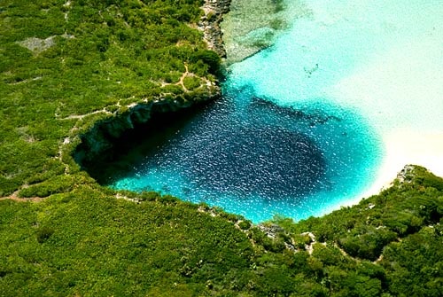 Photo:  Blue Hole on Long Island in the Bahamas is the world's deepest at more than 600 feet deep.